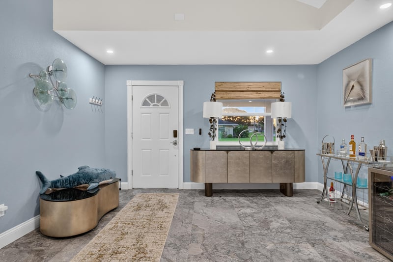 Entry foyer with decorative bar cabinet at 1525 8th St N, Jacksonville Beach, FL