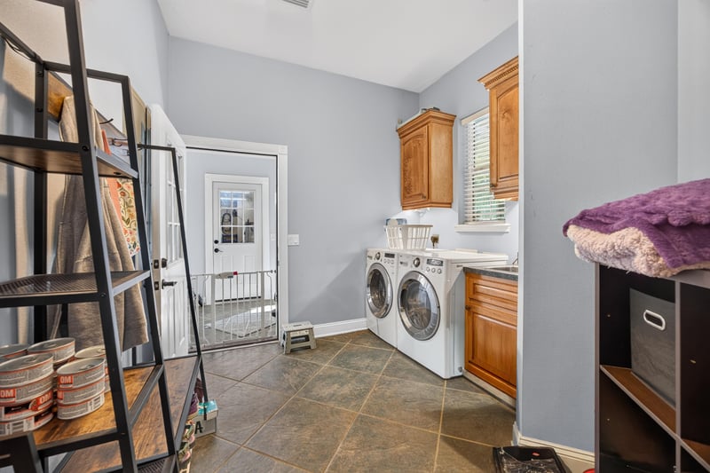 Laundry room with cabinets and closet at 1735 Hagans Ridge Ct