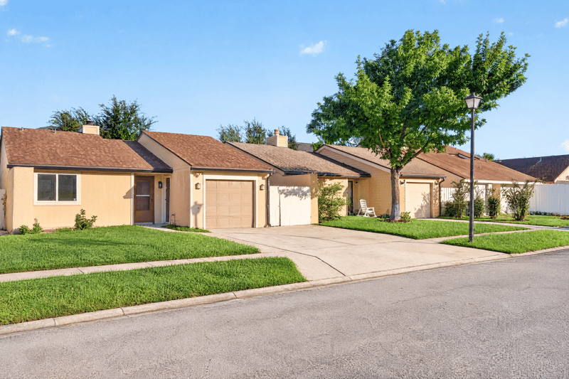 Front exterior view with attached garage at 8177 Virgo St, Jacksonville, FL 32216