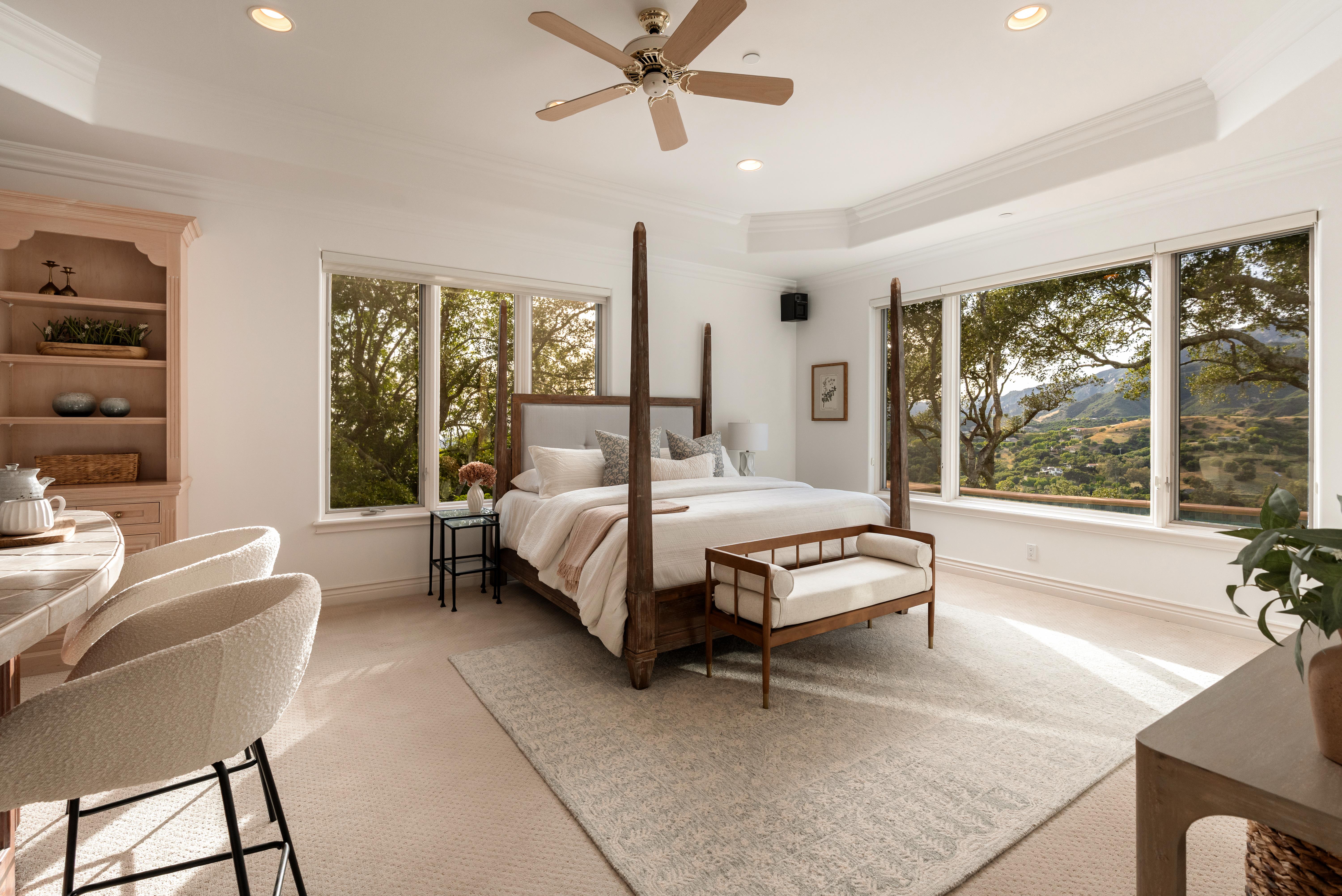 Interior living room photography at luxury Montecito-area estate, 450 El Cielito Rd, Santa Barbara — virtual real estate photography highlighting volume, natural light, and refined finishes with Channel Islands visible beyond. Our team captured still photography, aerial drone photography, twilight photography, a Matterport virtual tour, a 2D floor plan, and a custom property website from afternoon through twilight.