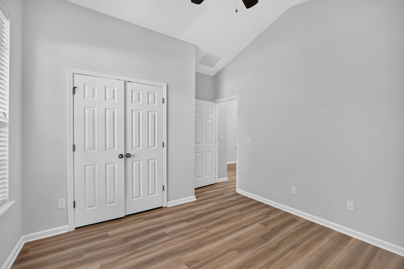Secondary bedroom with double closet doors at 3101 E Banister Rd, St. Augustine, FL 32092