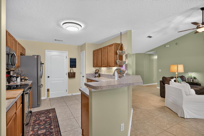 Kitchen view toward living room at 1589 Backwater Drive, Middleburg, FL 32068