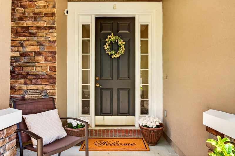 Front entry door with sidelights and covered porch at 3660 Middlebrook Dr, Orange Park, FL 32065