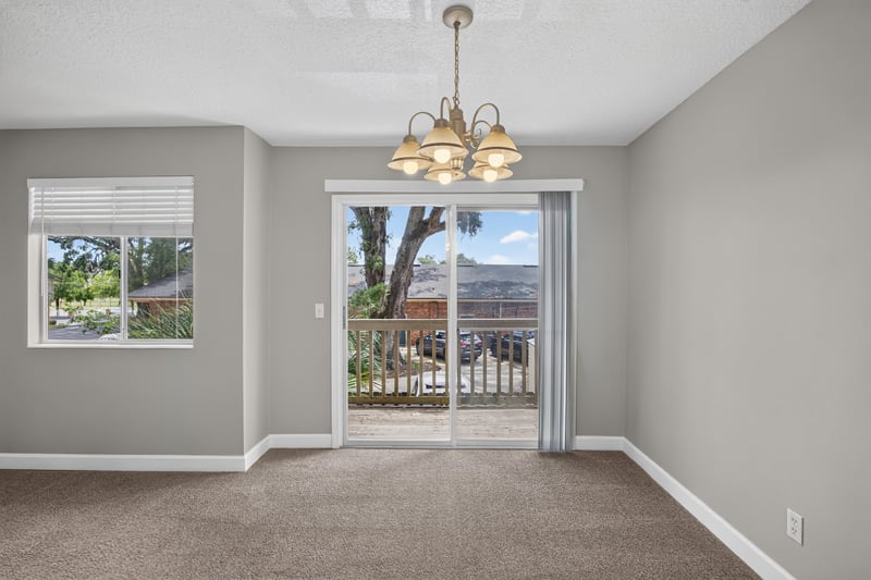 Dining area window and sliding door to balcony at 1800 Park Ave apt 358, Orange Park, FL