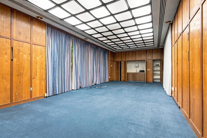 Conference room with skylight and wood paneling at 101 Scholars Wy