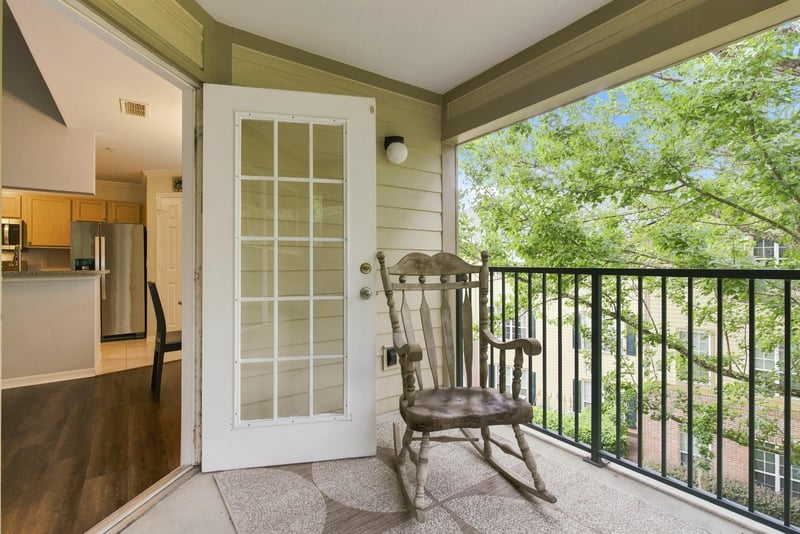 Screened porch off the kitchen with tree view at 7800 Point Meadows Dr, Jacksonville, FL 32256