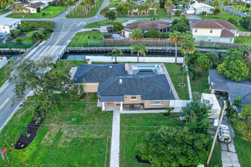 Aerial view of the home and backyard pool at 1525 8th St N, Jacksonville Beach, FL