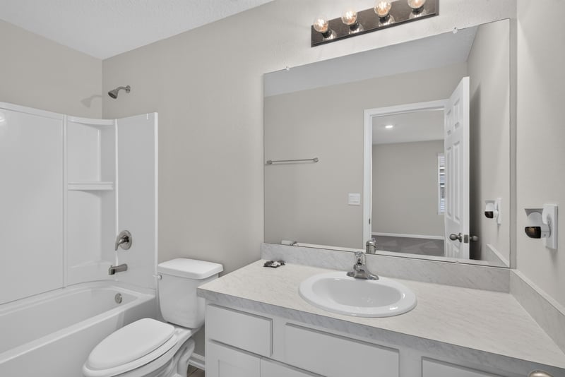 Primary bathroom with tub shower and vanity at 4024 Bay Hawk Ct, Jacksonville, FL