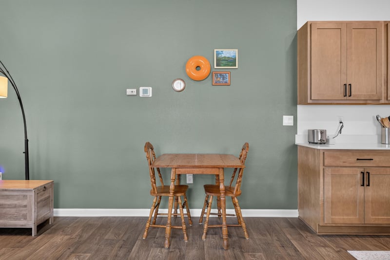 Dining area with wood table and chairs at 4276 Quaking St, Jacksonville, FL 32218