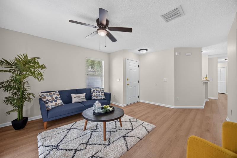 Living room open to dining area at 605 N Covered Bridge Rd, Jacksonville, FL