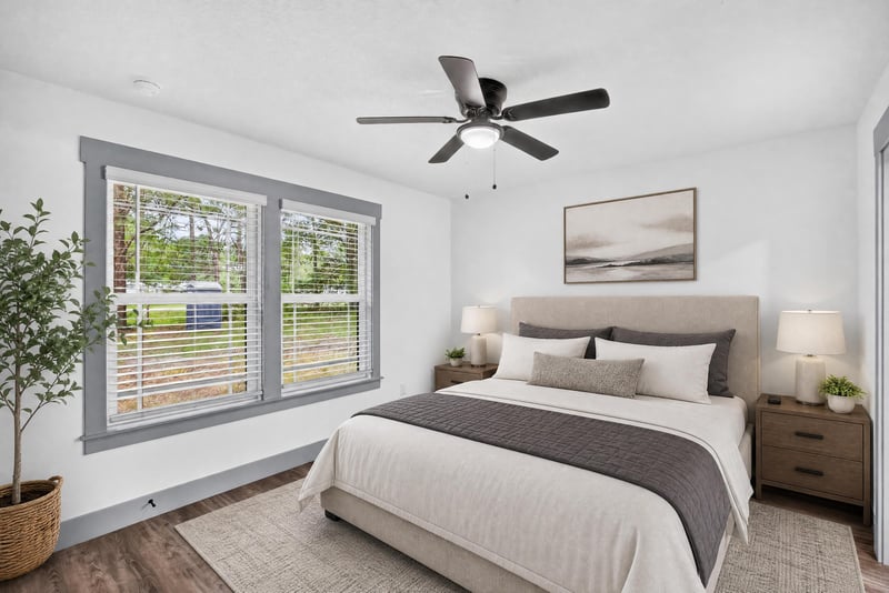 Bedroom staged with bed and nightstands at 4800 Acacia St, Middleburg, FL 32068