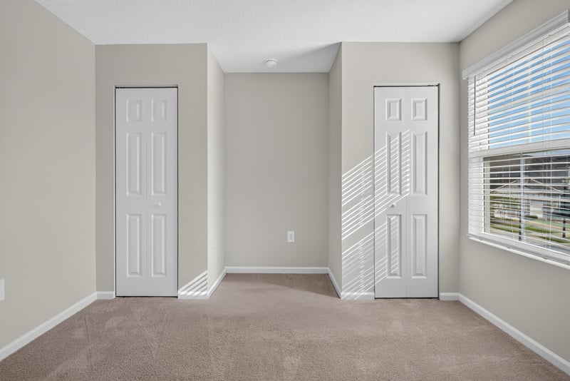 Closet doors and window in second bedroom at 4024 Bay Hawk Ct, Jacksonville, FL