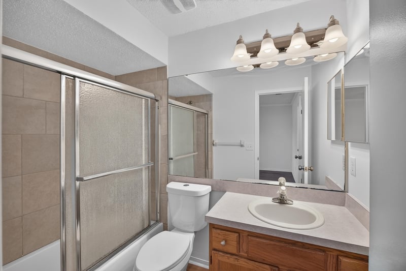 Bathroom with tub-shower combo and vanity at 8047 Mactavish Way E, Jacksonville, FL 32244