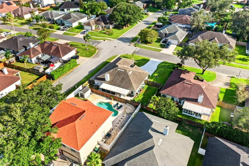 Aerial view of the home with community pool in distance at 12825 Kelsey Island Dr, Jacksonville, FL 32224