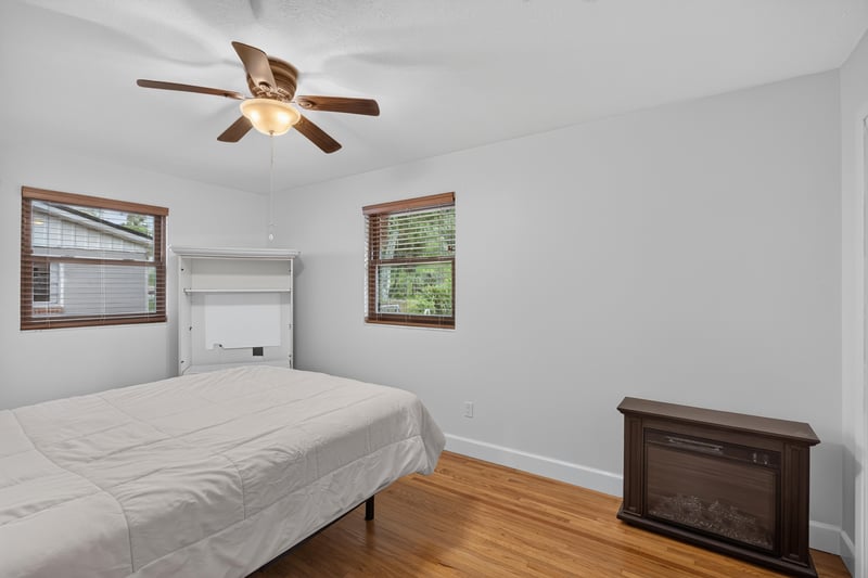 Bedroom with ceiling fan and bed at 1847 Grove Park Dr, Orange Park, FL