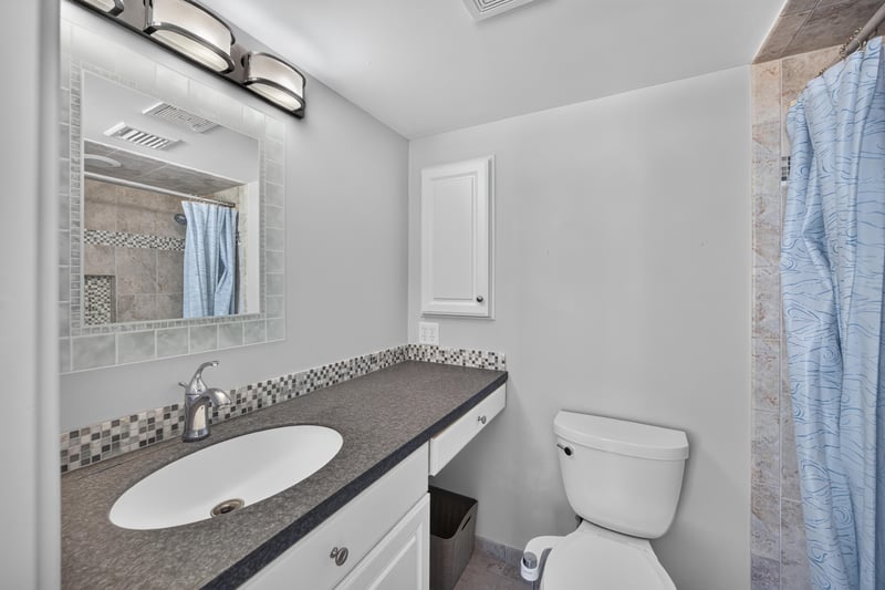 Bathroom vanity and mirror at 601 1st St S, Jacksonville Beach