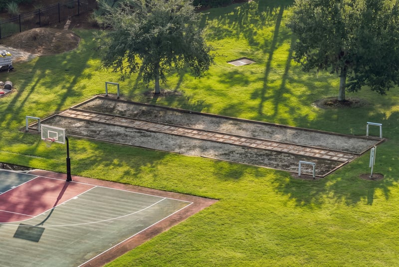 Community tennis court in Murabella