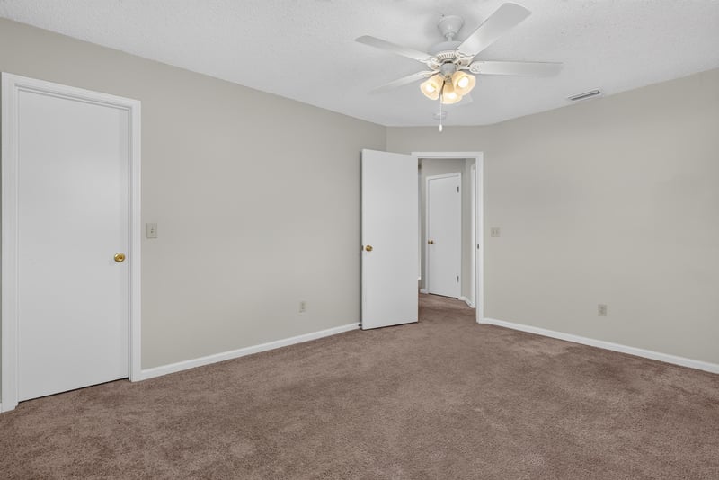 Bedroom with ceiling fan and closet door at 400 Ashcroft Landing Dr, Jacksonville, FL 32225