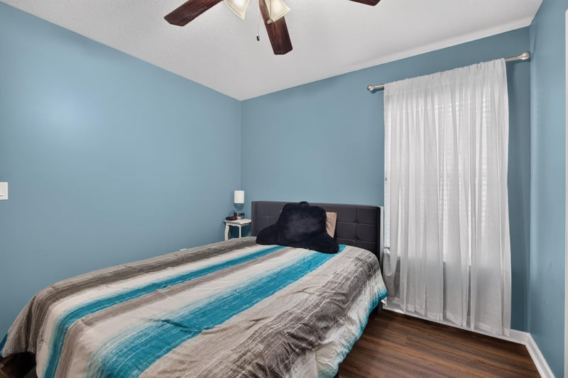 Secondary bedroom with ceiling fan and window at 3112 Silverado Cir, Green Cove Springs, FL 32043