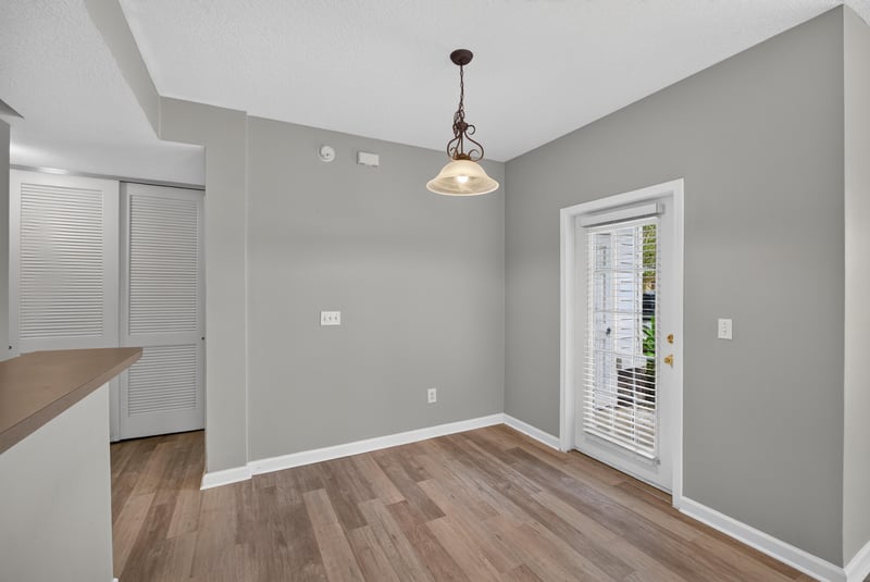 Dining nook with pendant light and door window at 575 Oakleaf Plantation Pkwy, Orange Park, FL 32065