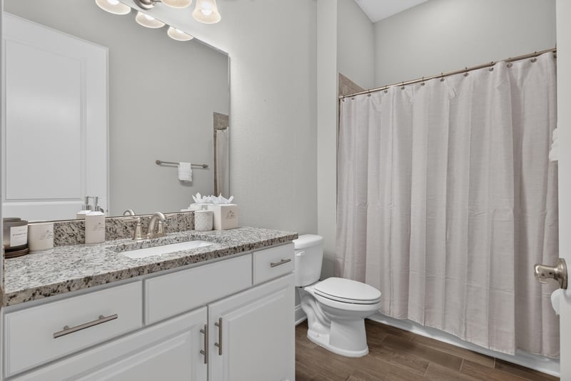 Bathroom vanity with tub and shower curtain at 3328 Southern Oaks Dr, Green Cove Springs, FL 32043