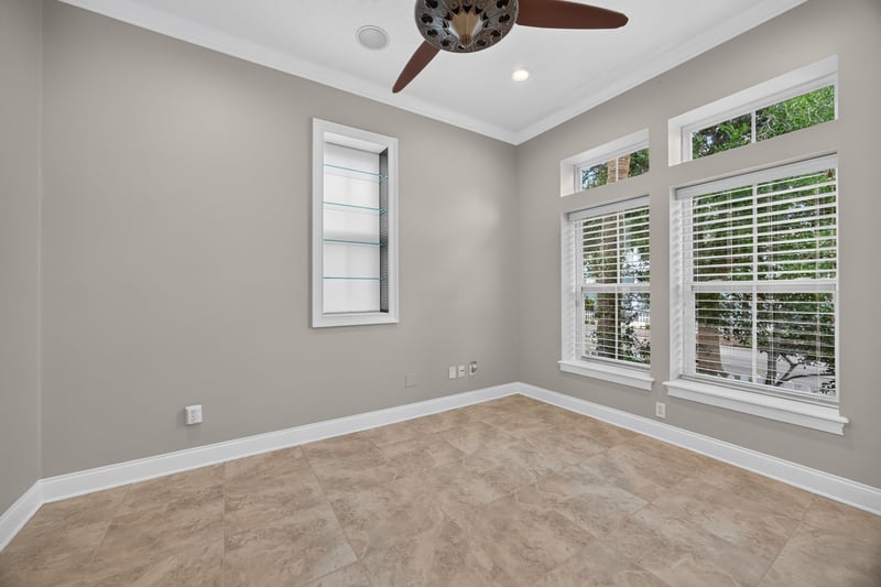 Empty room with large windows at 117 Island Cottage Way, St. Augustine, FL 32080