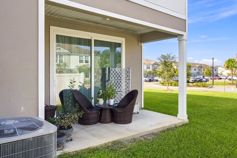 Covered front porch with seating area at 8359 Zenith Cir, Jacksonville, FL 32256
