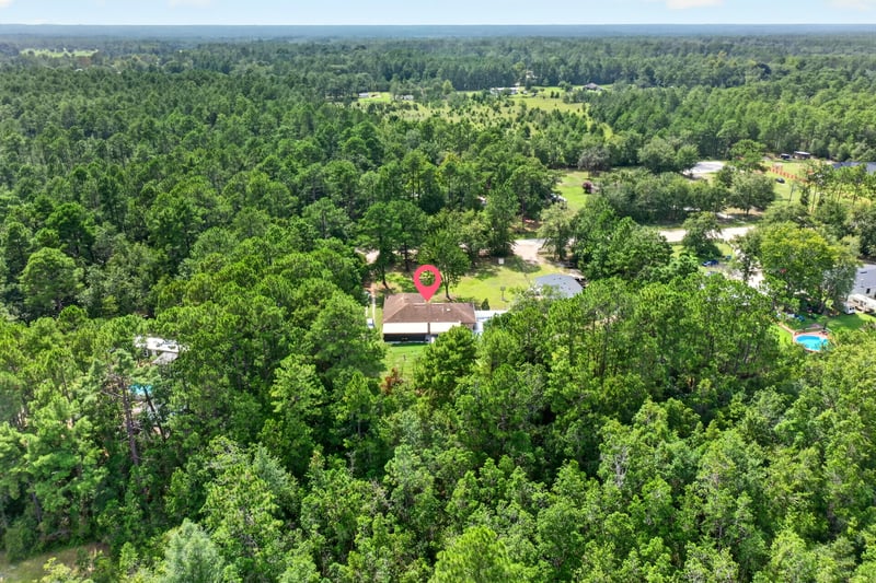 Aerial wide view of the wooded property in Middleburg, FL