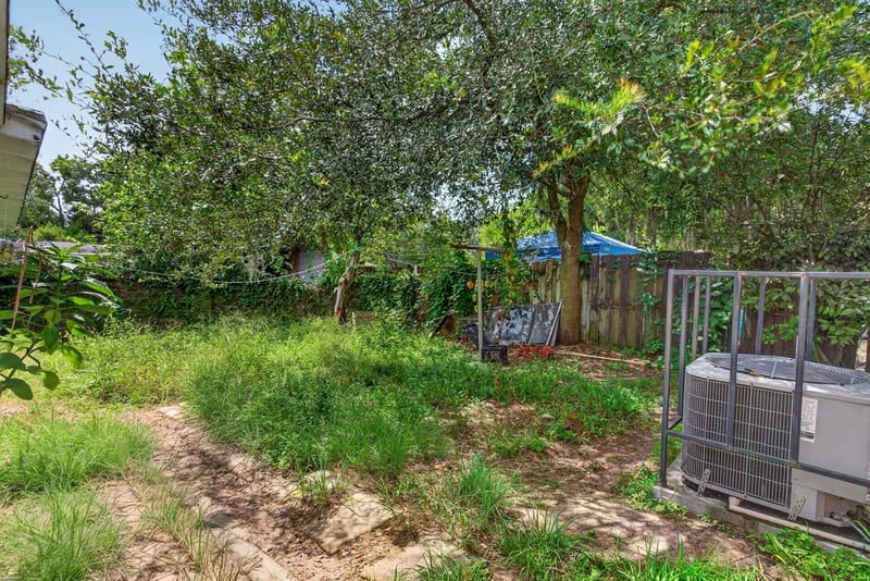 Backyard with grass and trees at 450 E 46th St, Jacksonville, FL 32208