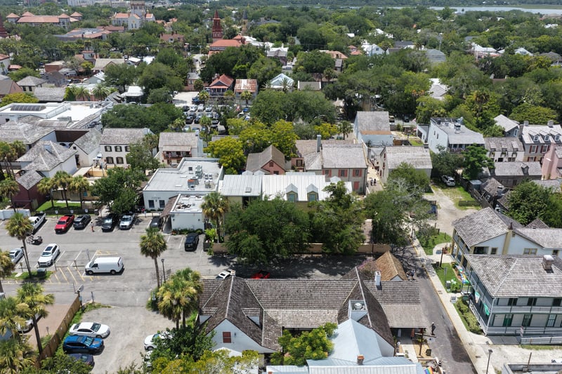 Aerial view of the property grounds and neighboring parking areas at 29 Cuna St, St. Augustine, FL 32084