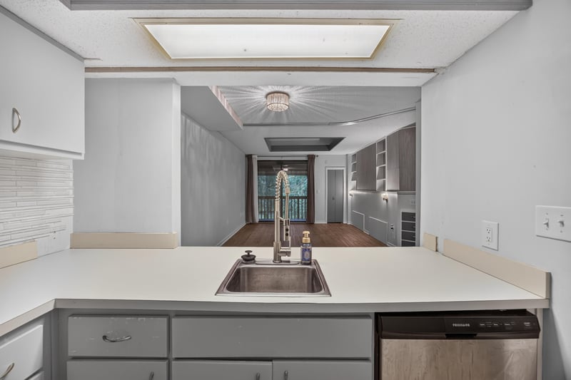 Kitchen with peninsula sink and dishwasher at 2910 Ravines Rd, Middleburg, FL 32068