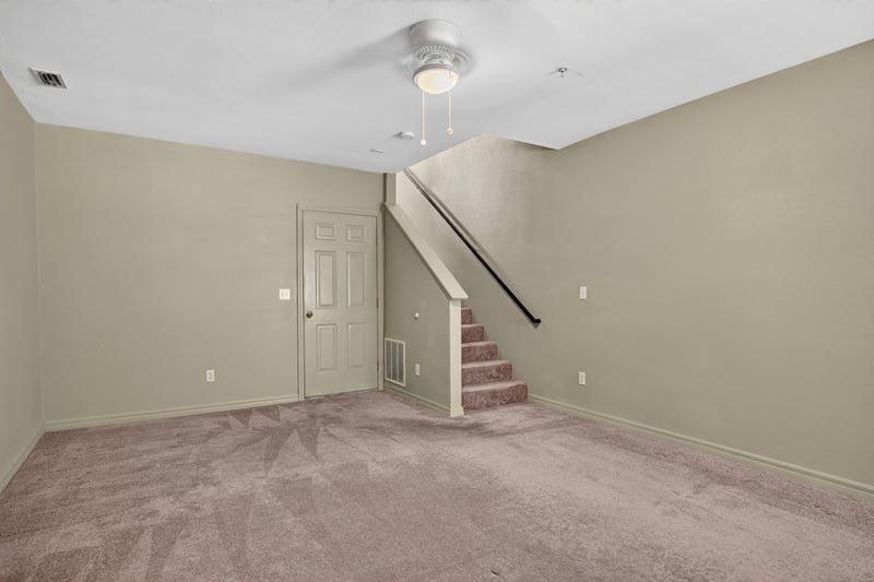 Upstairs landing with staircase and closet doors at 342 E Ashley St, Jacksonville, FL 32202
