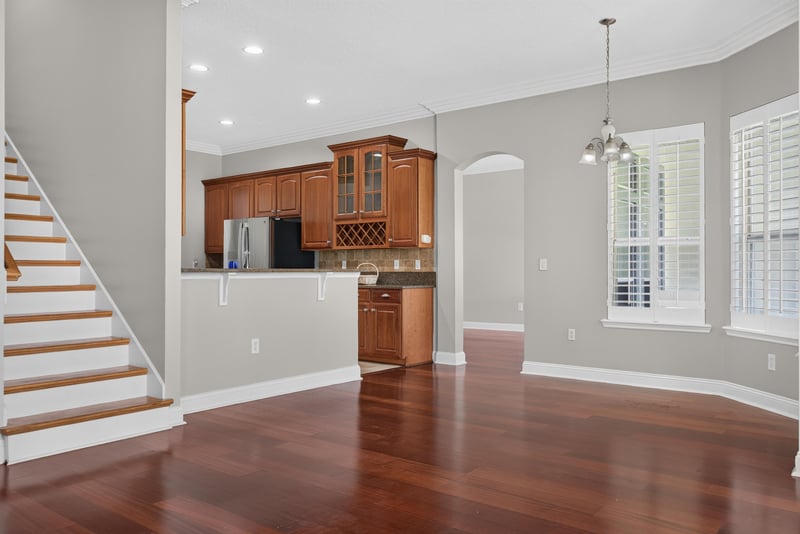 Staircase with view into the kitchen at 4109 Eagle Landing Pkwy, Orange Park, FL 32065