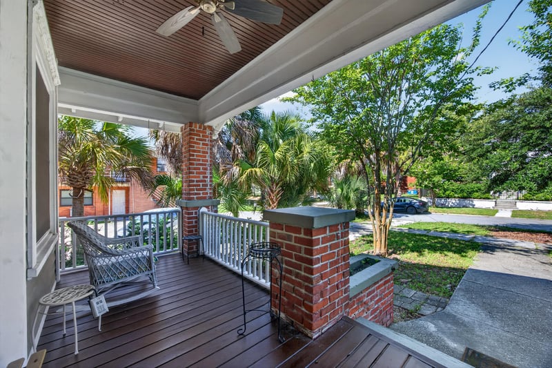Covered front porch with wood ceiling and brick columns at 1555 Belmonte Ave, Jacksonville, FL 32207