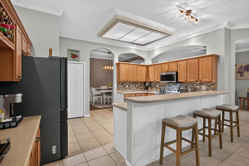 Kitchen with tile floor and tray ceiling at 2125 Blue Heron Cove Dr, Orange Park, FL 32003