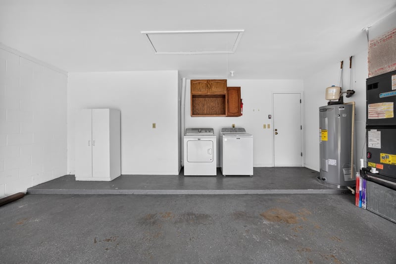 Garage laundry area with washer and dryer at 3407 Fairbanks Grant Rd N, Jacksonville, FL 32223