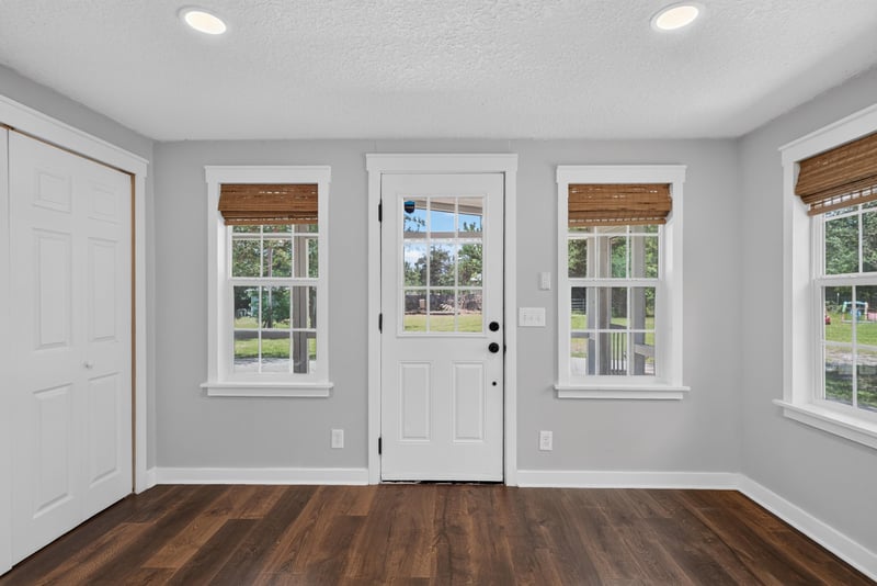 Entry room with wood floors and front door windows at 4890 McAllister Rd, Middleburg, FL 32068