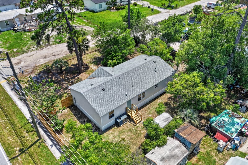 Aerial view of side yard and power lines at 7603 Coach Park Dr, Jacksonville, FL 32244