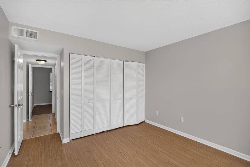 Bedroom with closets and hallway view at 700 W Pope Rd unit h61, St. Augustine, FL 32080