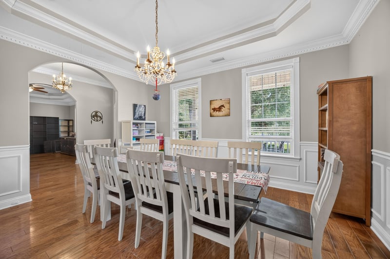 Dining room with long table and chandelier at 1735 Hagans Ridge Ct