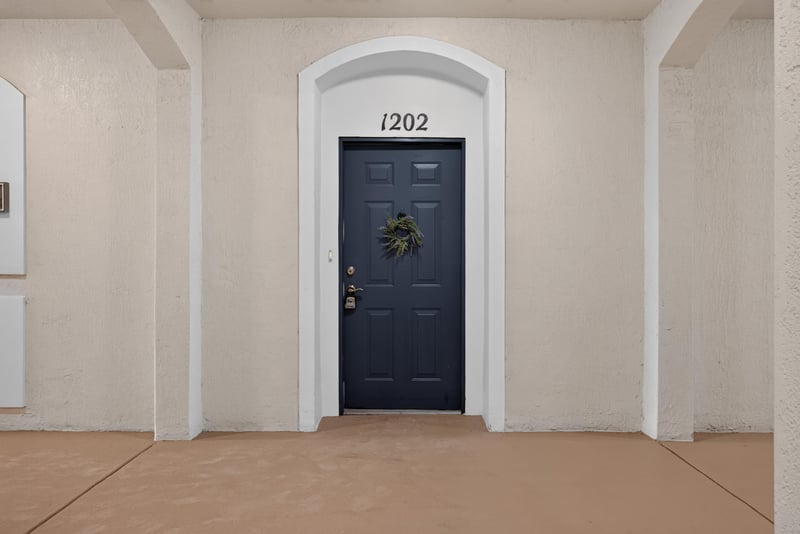 Close view of the front door numbered 1202 at 11251 Campfield Dr unit 1202, Jacksonville, FL 32256