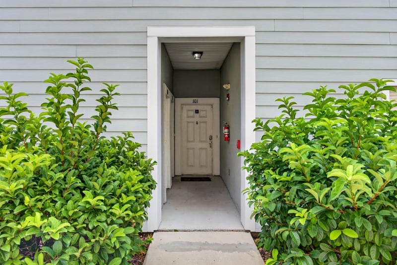 Front door framed by greenery at 7047 Deer Lodge Cir, Jacksonville