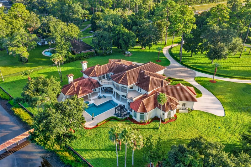 Aerial view of the property amid mature trees at 344 Broward Rd, Jacksonville, FL