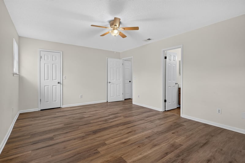 Empty room with wood floors and ceiling fan at 4427 Millstone Ct, Jacksonville, FL
