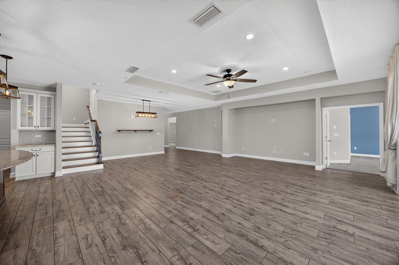 Open living area with staircase and windows at 53 Lumen Ct, St. Augustine, FL 32095