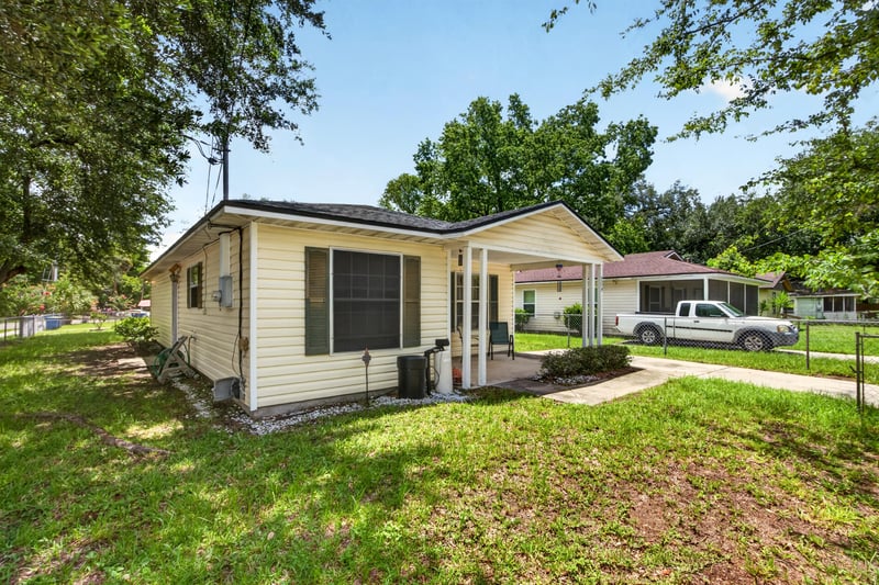 Front exterior angled view with driveway at 5375 Dodge Rd, Jacksonville, FL 32209