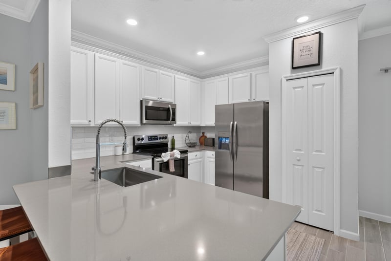 Kitchen island with quartz counter at 1186 Beach Dune Dr, Jacksonville, FL 32233