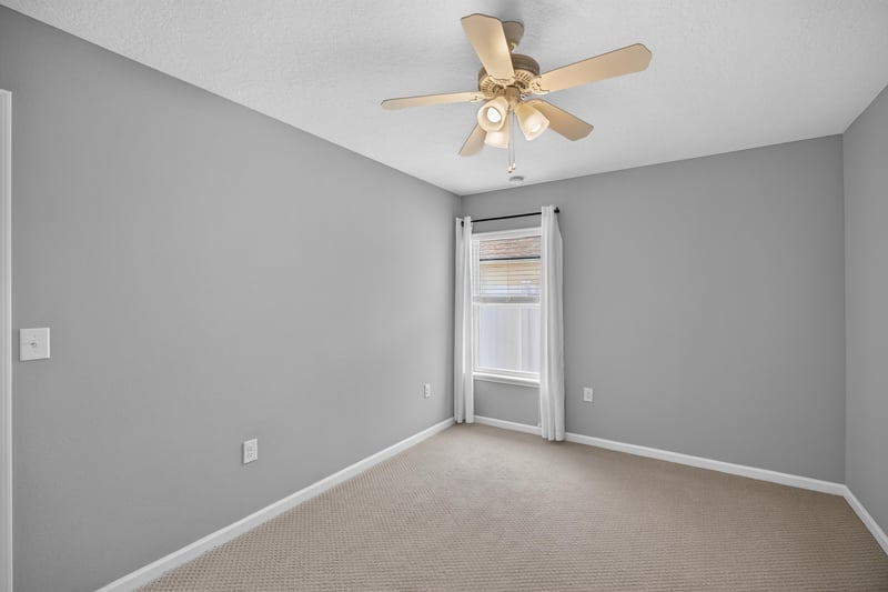 Empty carpeted room with ceiling fan at 85 Amia Dr, St. Augustine, FL 32086