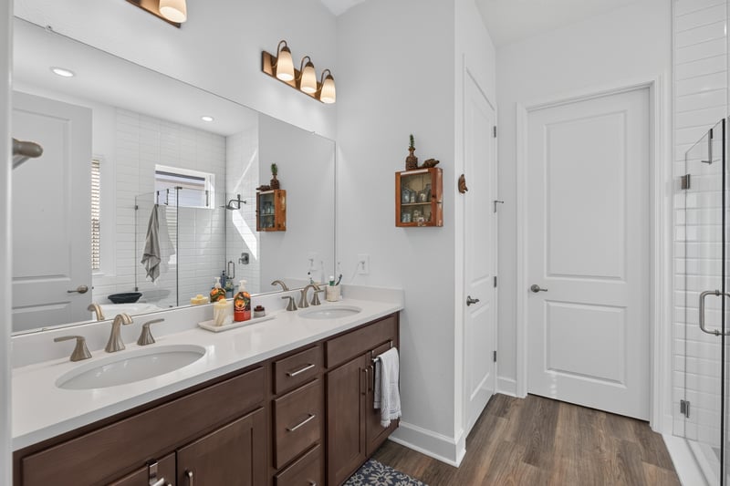 Bathroom vanity with double sconces at 129 Amberwood Dr, St. Augustine, FL