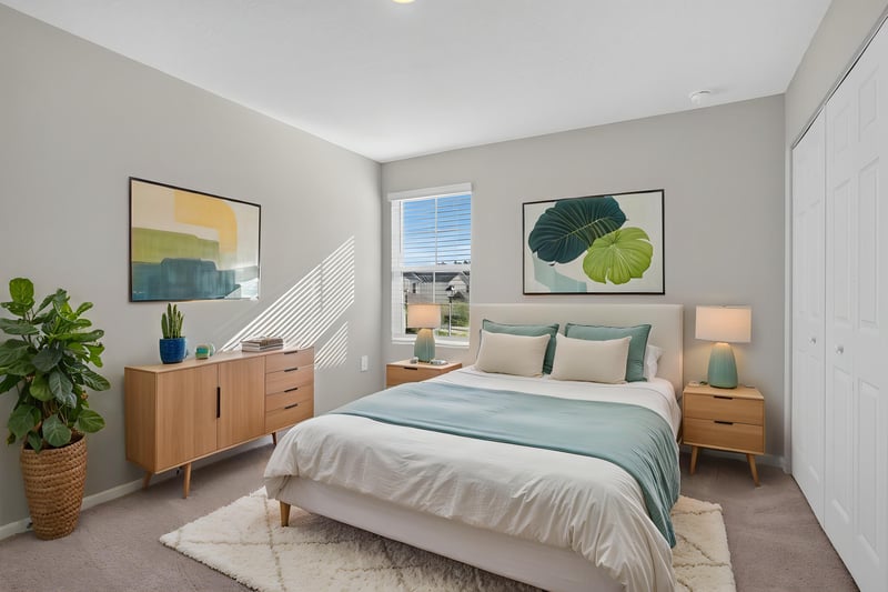 Third bedroom with staged bed and artwork at 4024 Bay Hawk Ct, Jacksonville, FL